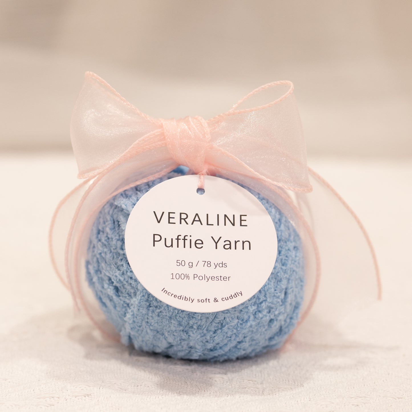 Veraline Puffie Yarn 04 Sky Whip Blue soft fluffy polyester yarn skein for knitting, crochet, and plush craft projects