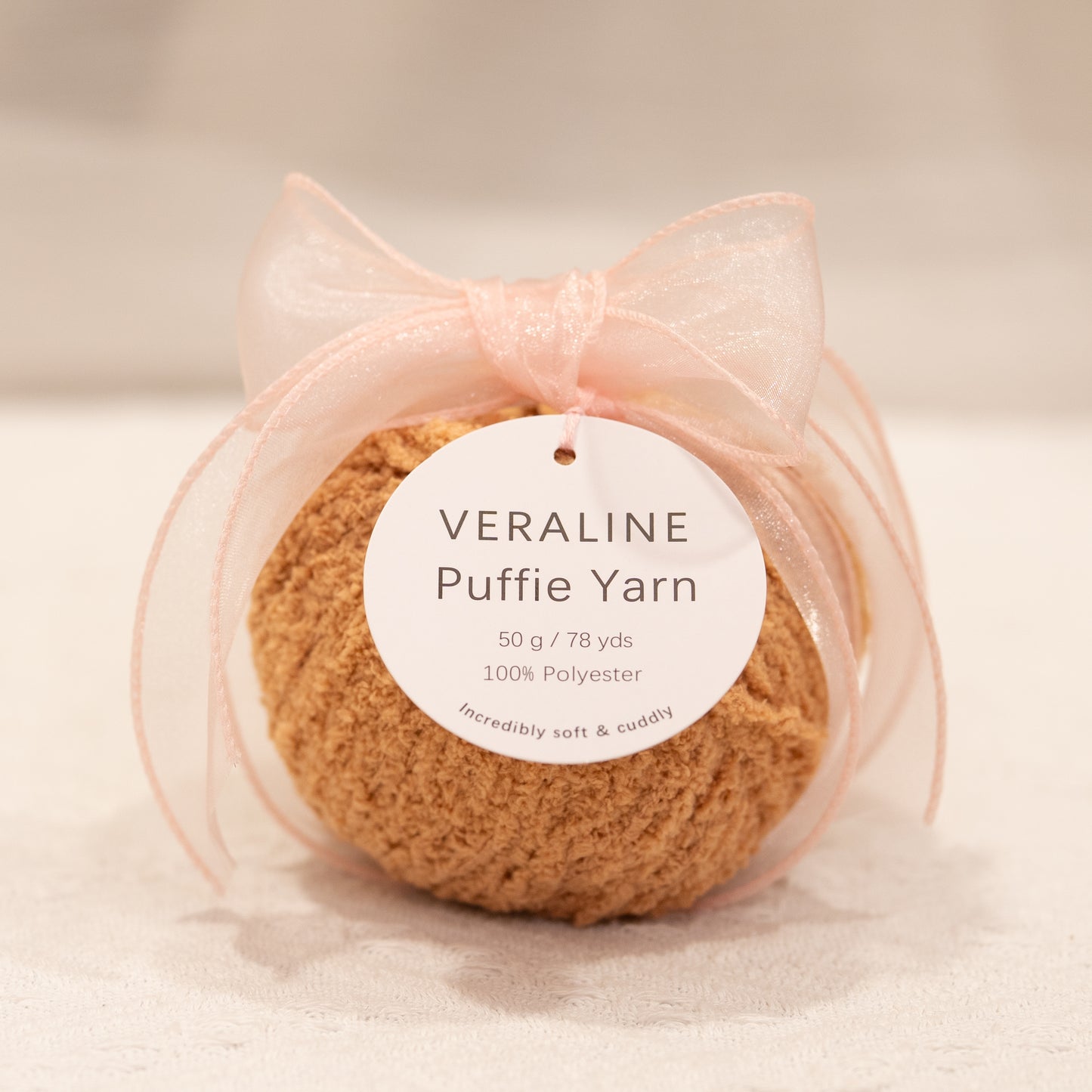 Veraline Puffie Yarn 09 Caramel Drizzle Brown soft fluffy polyester yarn skein for knitting, crochet, and plush craft projects