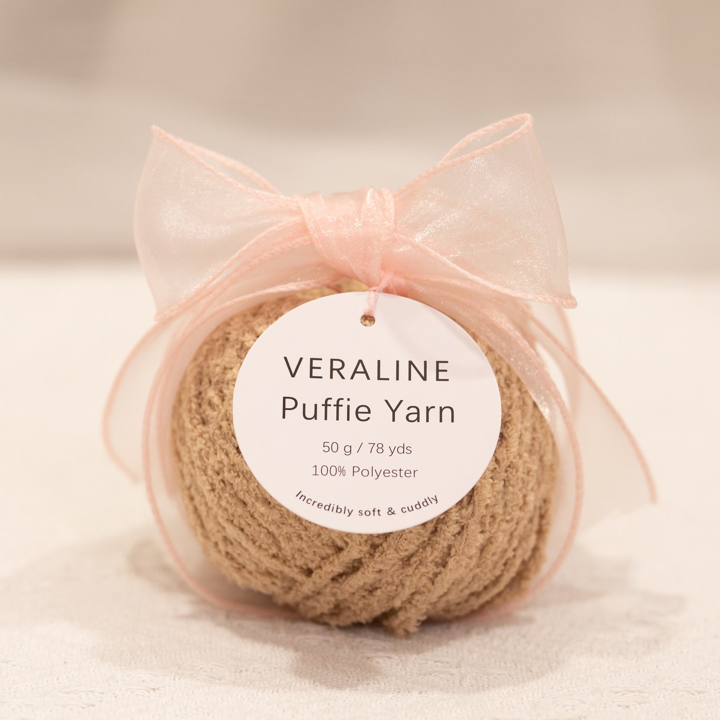 Veraline Puffie Yarn 14 Oat Milk Taupe soft fluffy polyester yarn skein for knitting, crochet, and plush craft projects