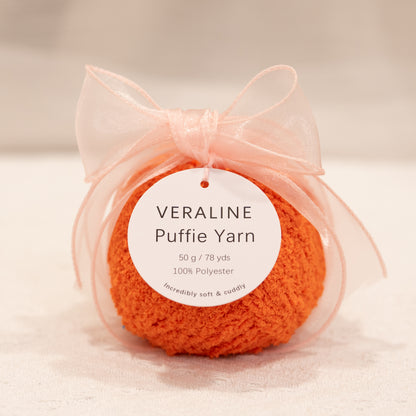 Veraline Puffie Yarn 16 Tangerine Pop Orange soft fluffy polyester yarn skein for knitting, crochet, and plush craft projects