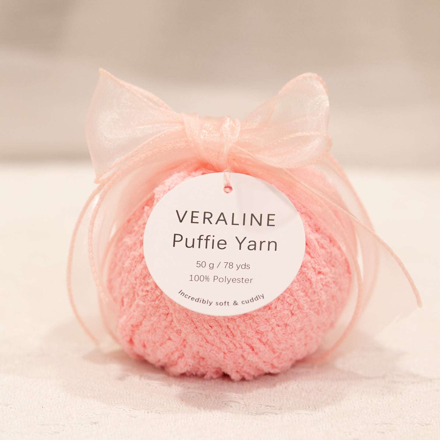 Veraline Puffie Yarn 17 Strawberry Milk Pink soft fluffy polyester yarn skein for knitting, crochet, and plush craft projects