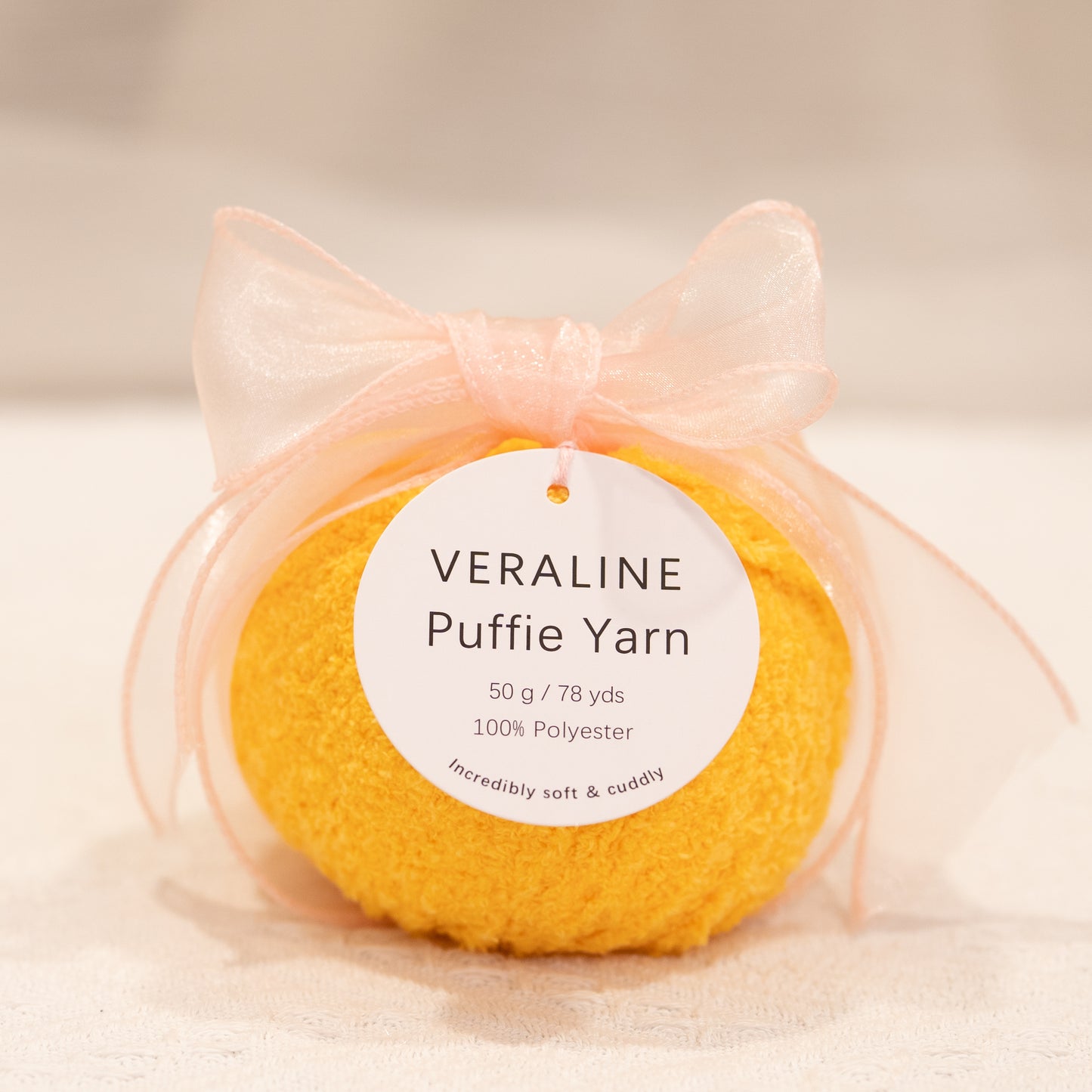 Veraline Puffie Yarn 18 Mango Mousse Yellow soft fluffy polyester yarn skein for knitting, crochet, and plush craft projects