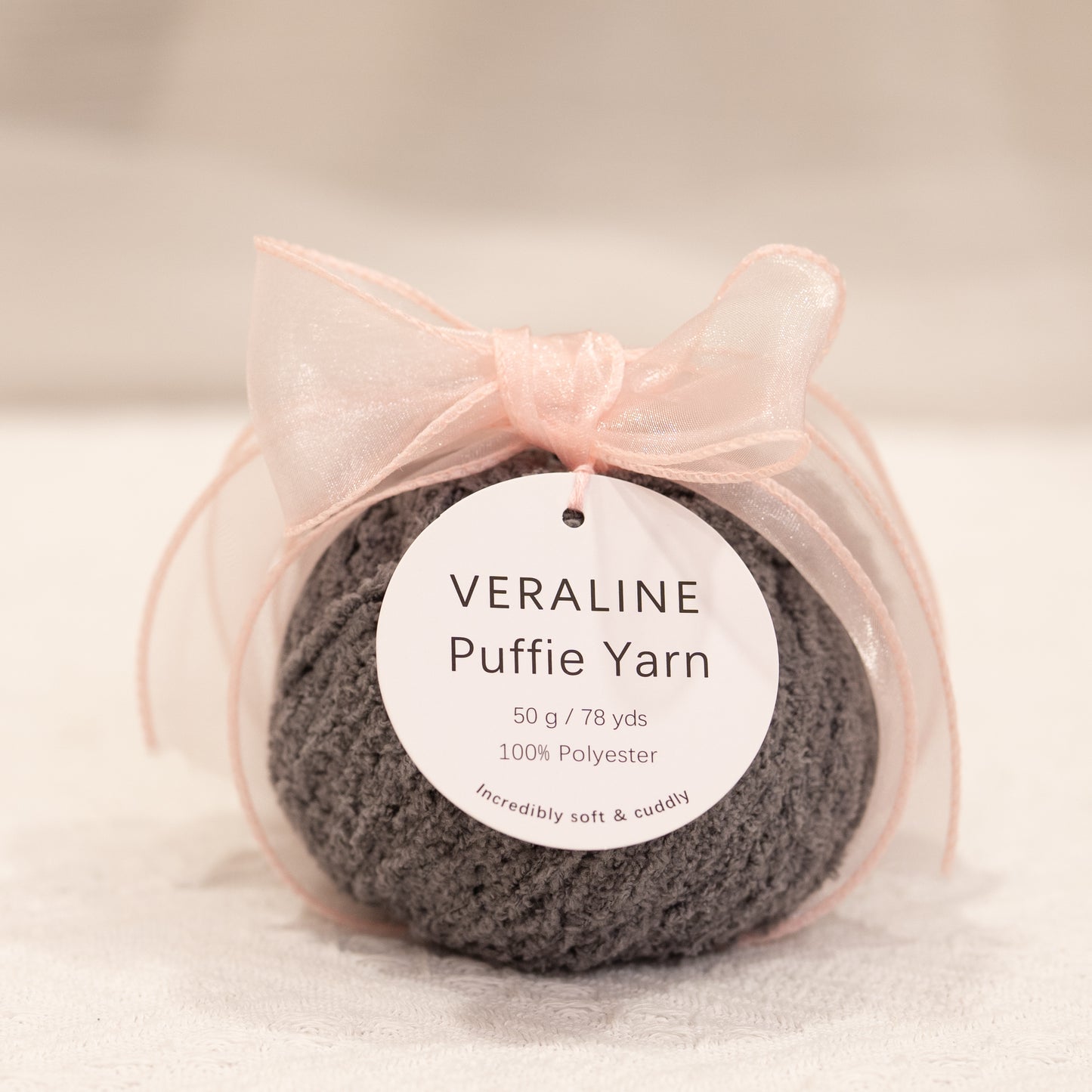 Veraline Puffie Yarn 32 Charcoal Truffle soft fluffy polyester yarn skein for knitting, crochet, and plush craft projects