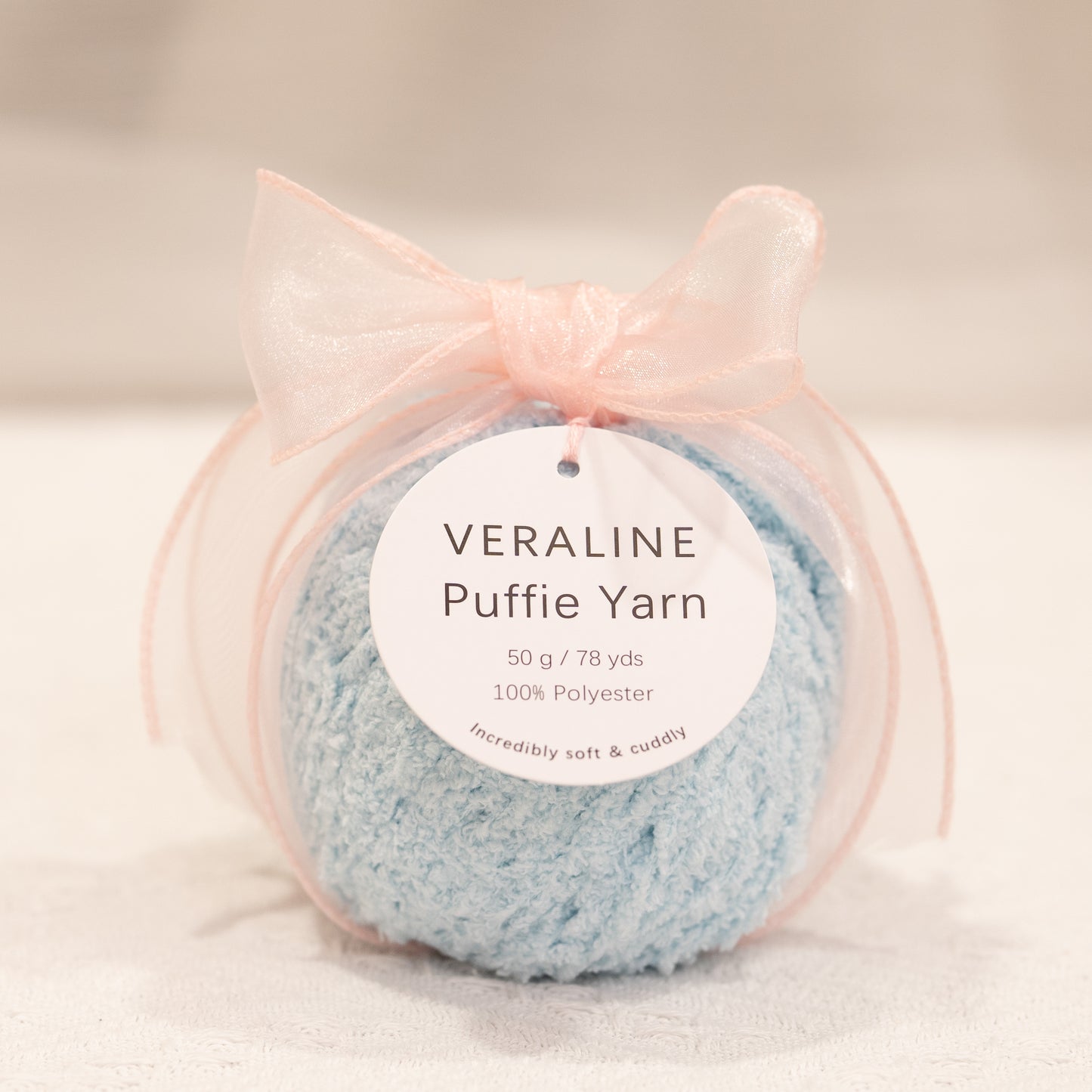 Veraline Puffie Yarn 33 Icy Blue Cream soft fluffy polyester yarn skein for knitting, crochet, and plush craft projects