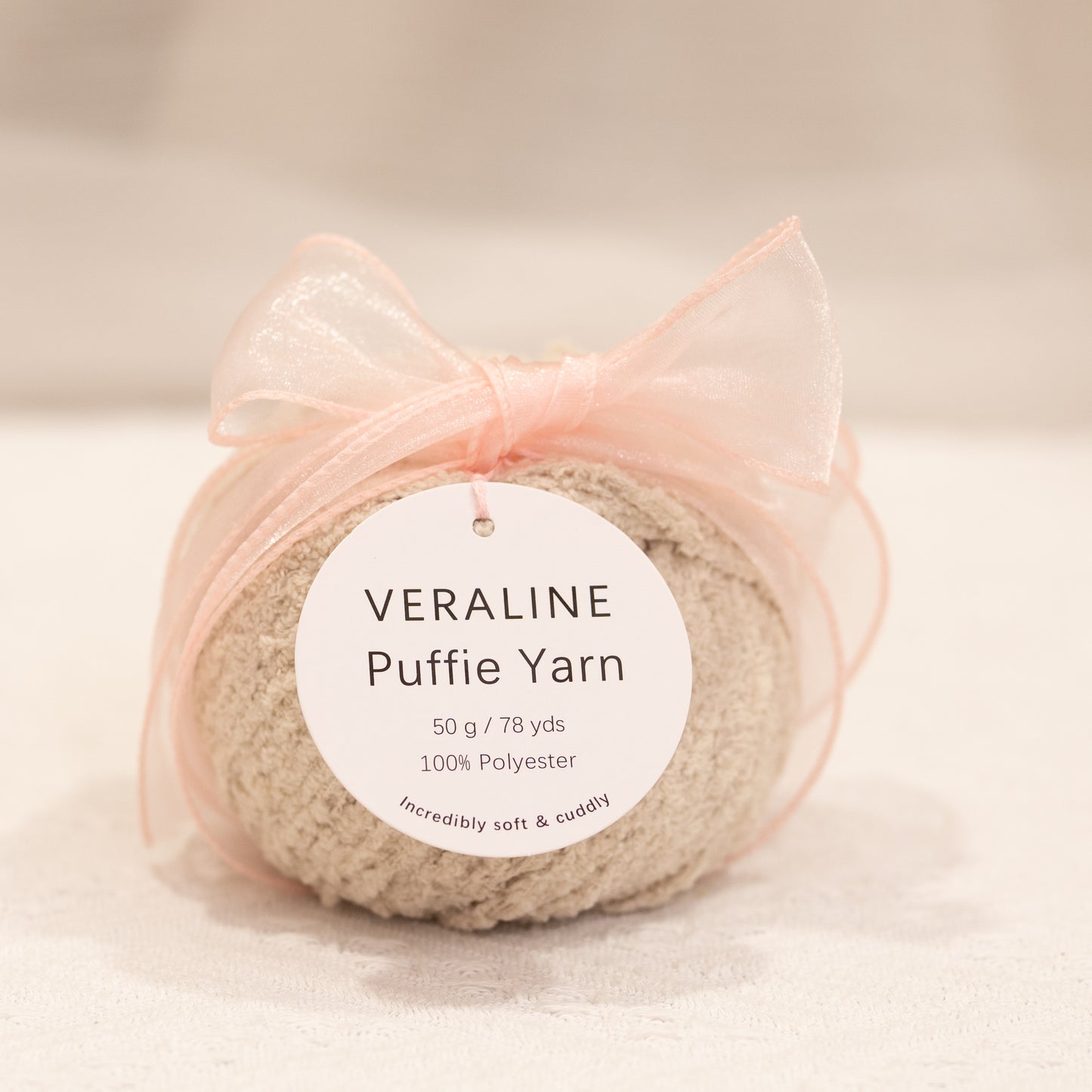 Veraline Puffie Yarn 38 Oat Crumble Beige soft fluffy polyester yarn skein for knitting, crochet, and plush craft projects