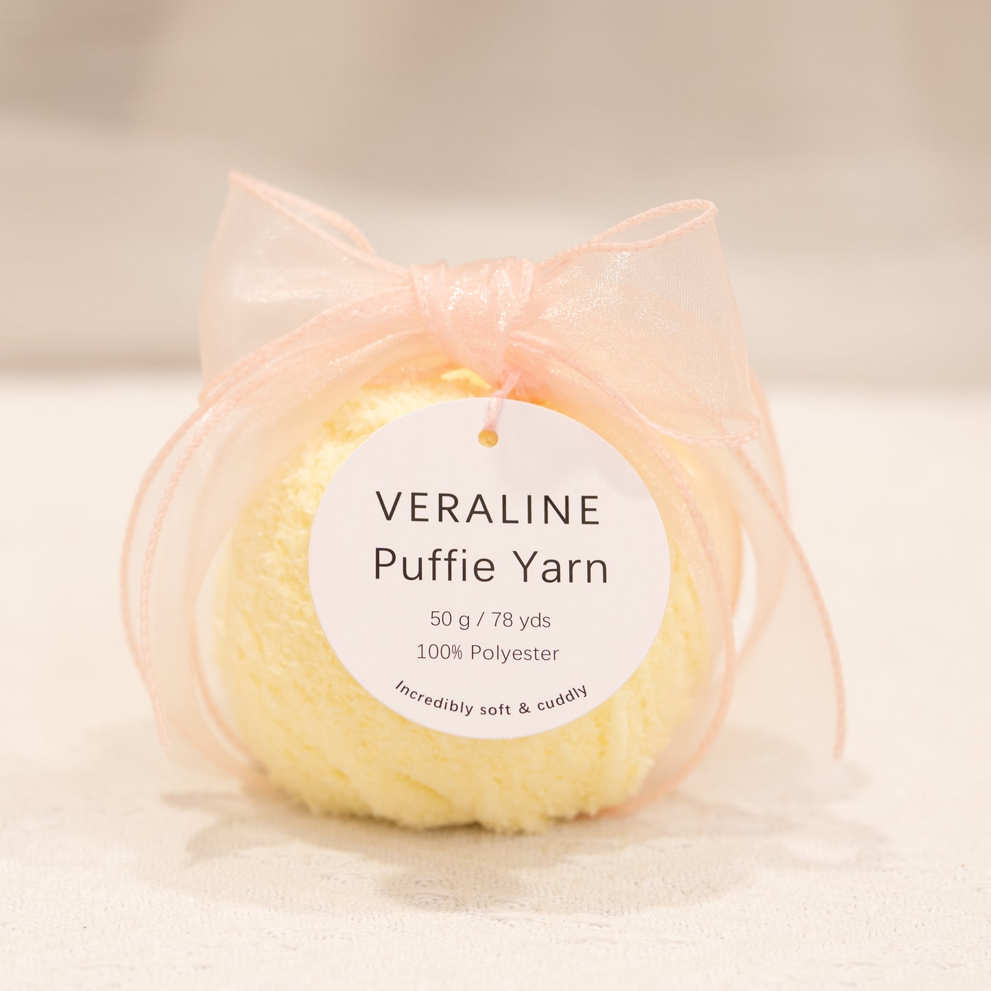 Veraline Puffie Yarn 39 Lemon Soufflé soft fluffy polyester yarn skein for knitting, crochet, and plush craft projects