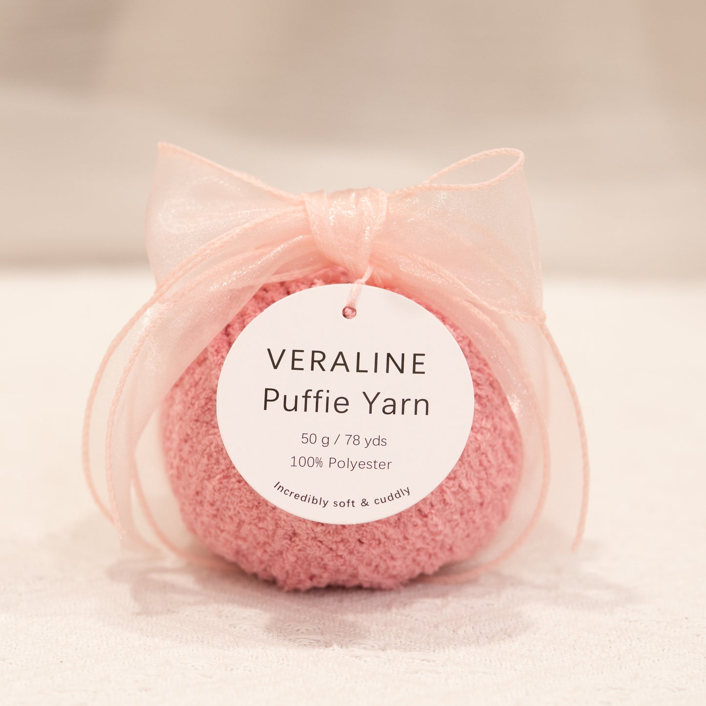 Veraline Puffie Yarn 40 Rose Soufflé Pink soft fluffy polyester yarn skein for knitting, crochet, and plush craft projects