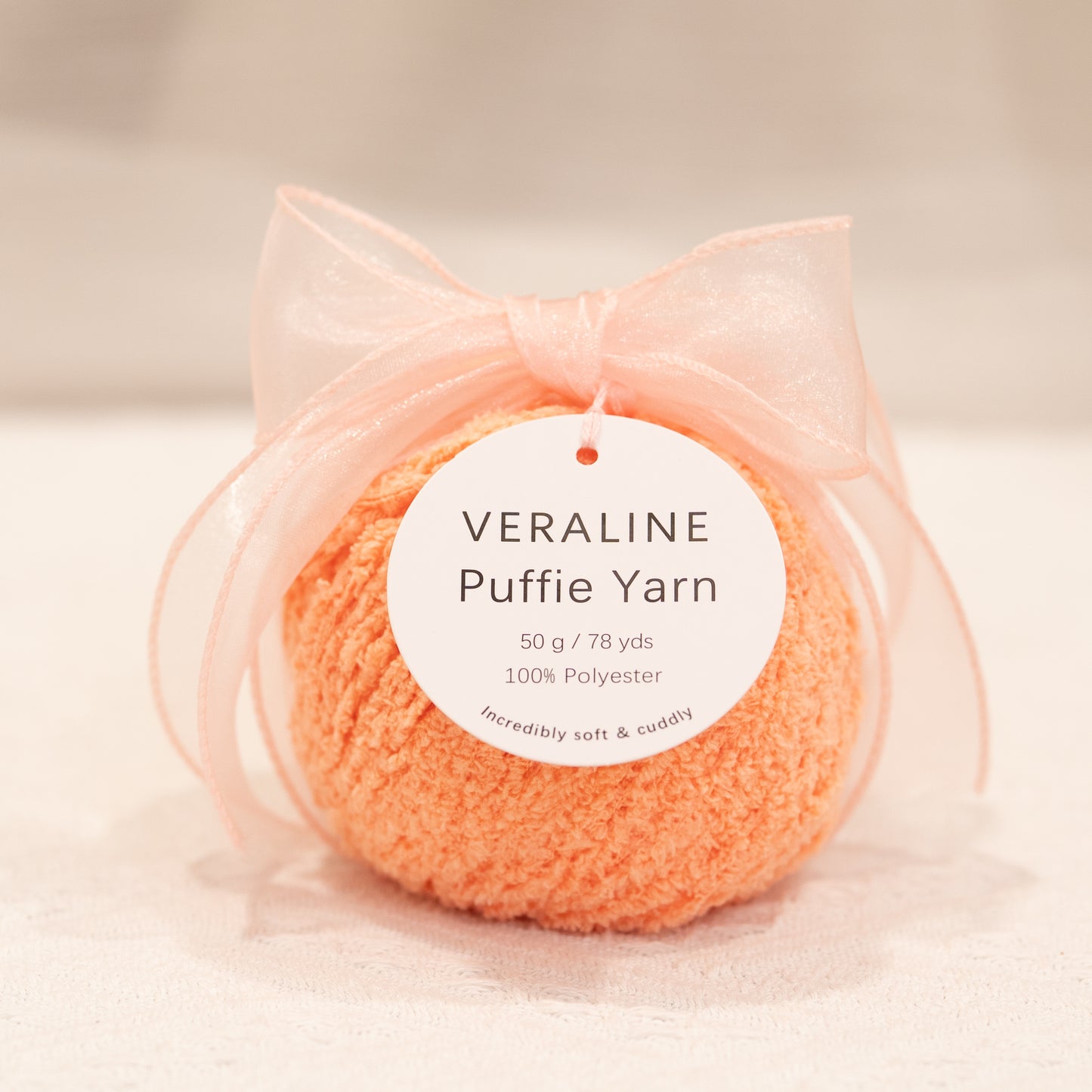 Veraline Puffie Yarn 46 Coral Cream soft fluffy polyester yarn skein for knitting, crochet, and plush craft projects